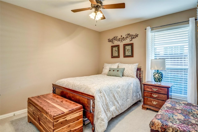 bedroom featuring carpet floors, a ceiling fan, and baseboards