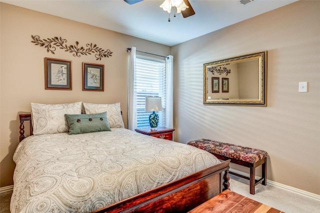 carpeted bedroom with a ceiling fan, visible vents, and baseboards