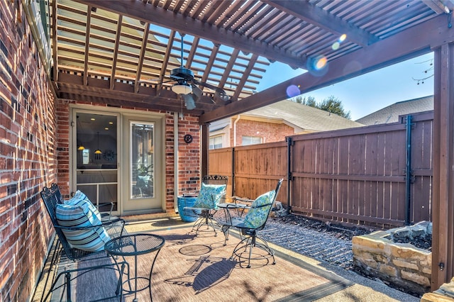 view of patio with a fenced backyard, a ceiling fan, and a pergola