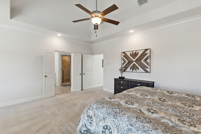 bedroom with crown molding, a raised ceiling, light colored carpet, visible vents, and baseboards