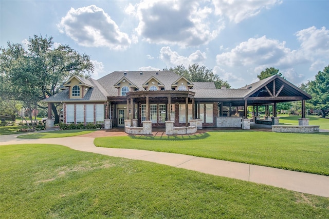 view of property's community with a lawn