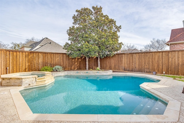 view of pool with a patio area, a fenced backyard, and a pool with connected hot tub