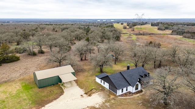 birds eye view of property with a rural view