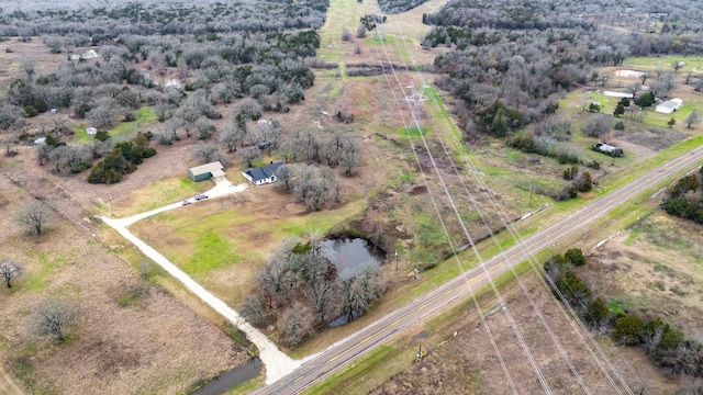 birds eye view of property featuring a rural view