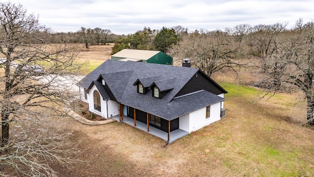 birds eye view of property with a forest view