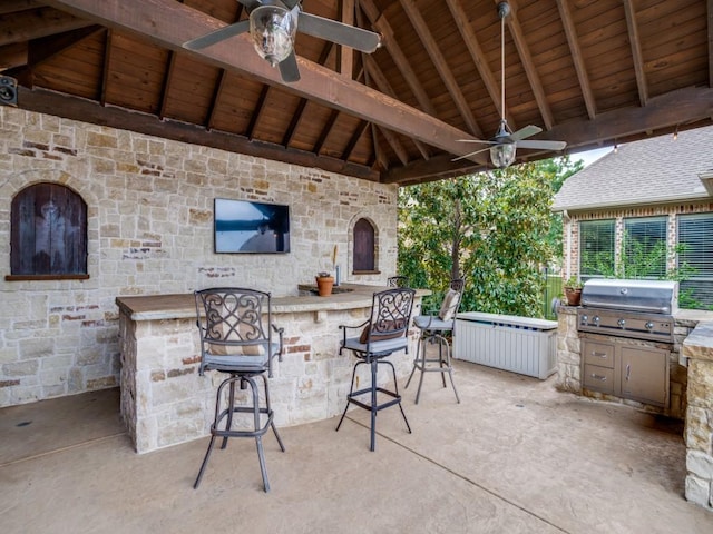 view of patio / terrace featuring ceiling fan, a gazebo, area for grilling, and outdoor wet bar