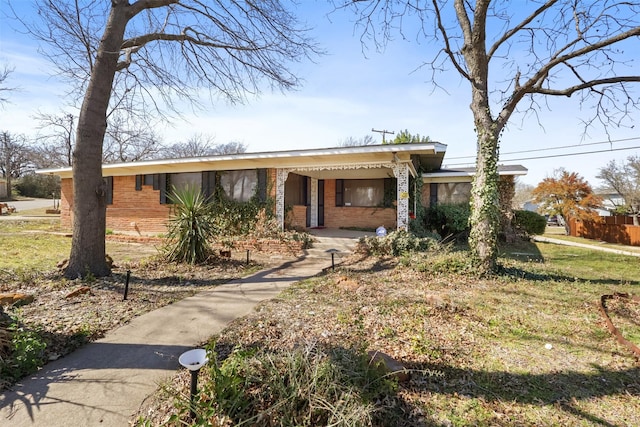 view of front of property featuring brick siding