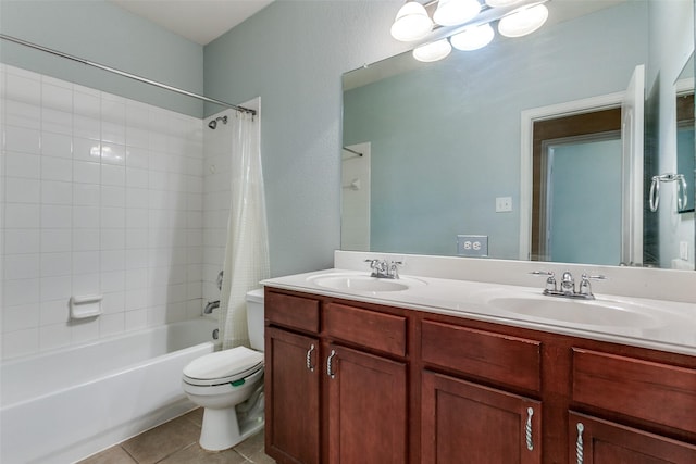 full bathroom featuring shower / bath combo, a sink, toilet, and tile patterned floors