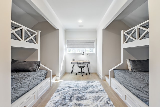 mudroom with light wood finished floors, visible vents, and baseboards