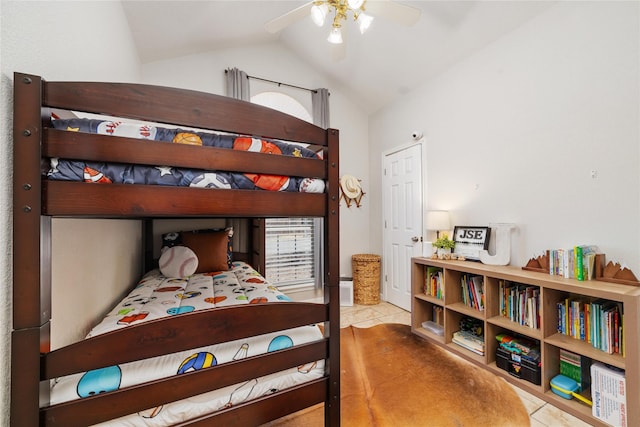 tiled bedroom featuring ceiling fan and vaulted ceiling