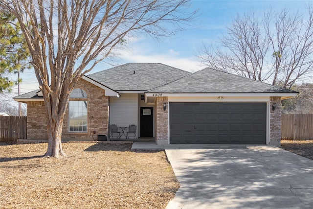 ranch-style home featuring a garage, driveway, roof with shingles, fence, and brick siding