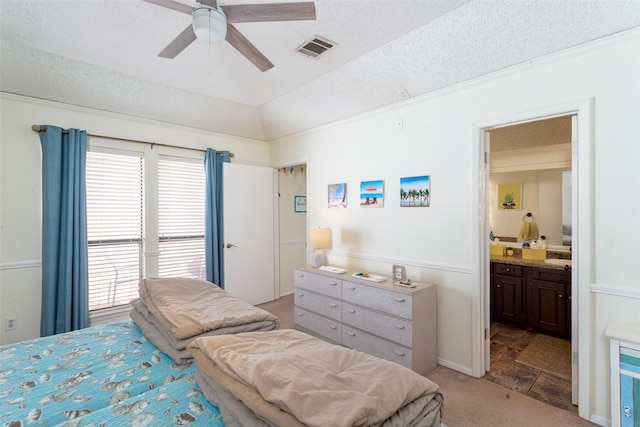 bedroom featuring light carpet, visible vents, a textured ceiling, and lofted ceiling