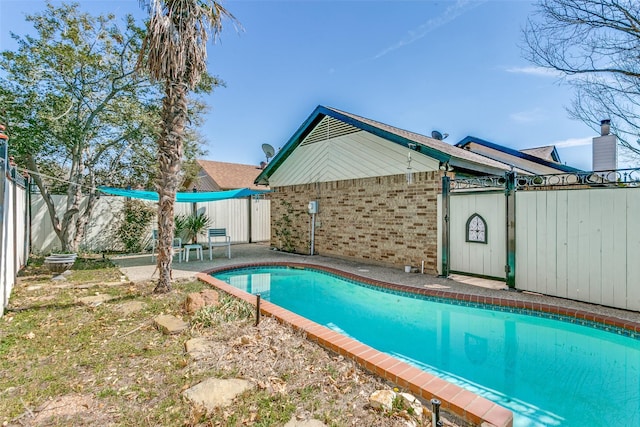 view of pool featuring a patio area, a fenced backyard, and a fenced in pool