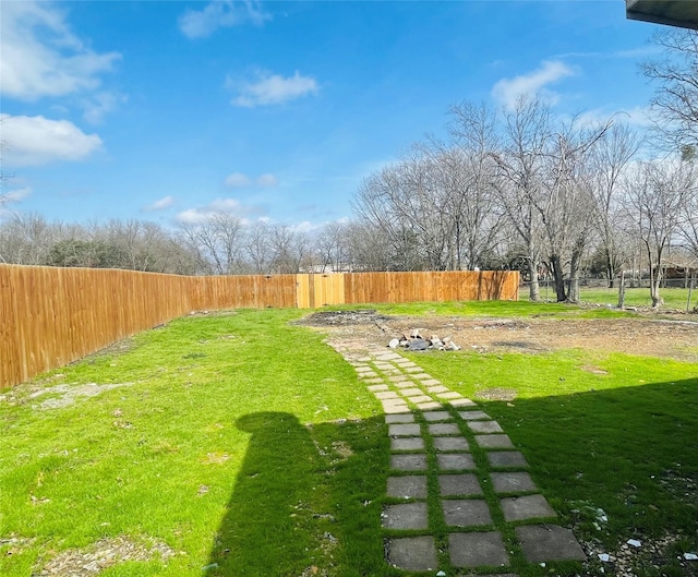 view of yard with a fenced backyard