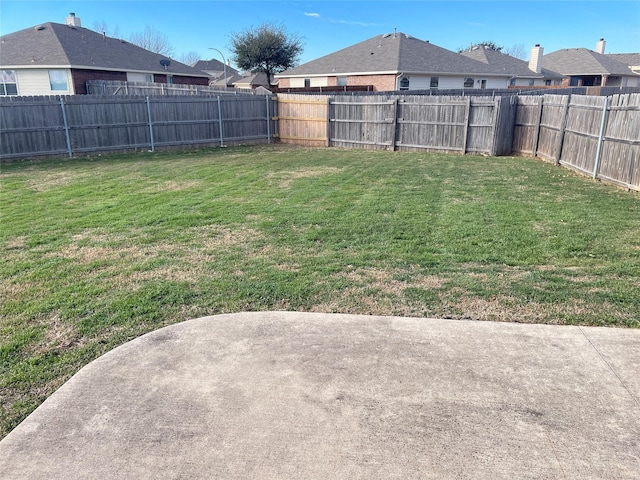 view of yard featuring a fenced backyard