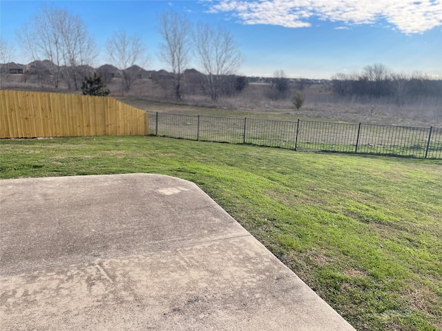 view of yard featuring a patio and fence