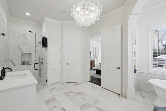 ensuite bathroom featuring ornamental molding, a stall shower, and marble finish floor