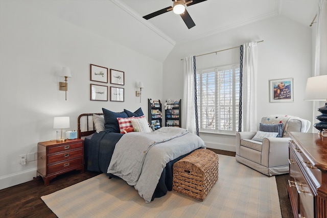 bedroom featuring baseboards, a ceiling fan, wood finished floors, vaulted ceiling, and crown molding