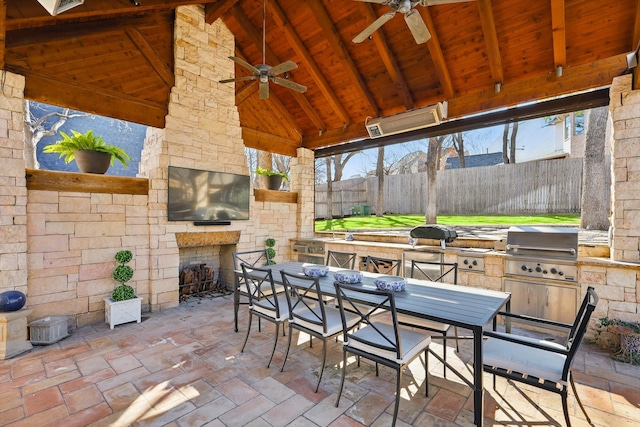 view of patio featuring area for grilling, ceiling fan, fence, outdoor dining area, and a gazebo