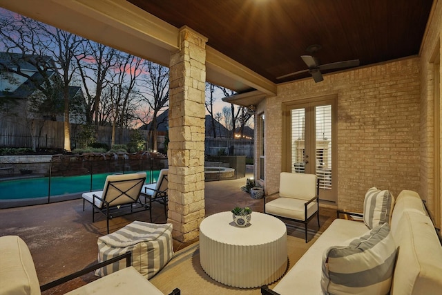 view of patio with a fenced backyard, a ceiling fan, an outdoor living space, french doors, and a fenced in pool