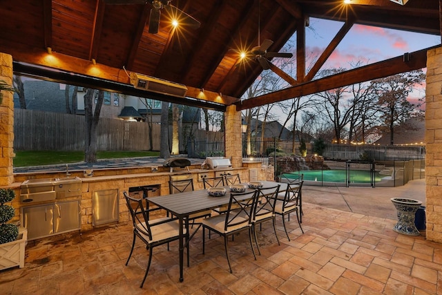 patio terrace at dusk featuring a fenced in pool, outdoor dining area, area for grilling, a gazebo, and fence