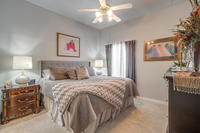 carpeted bedroom featuring a ceiling fan and baseboards