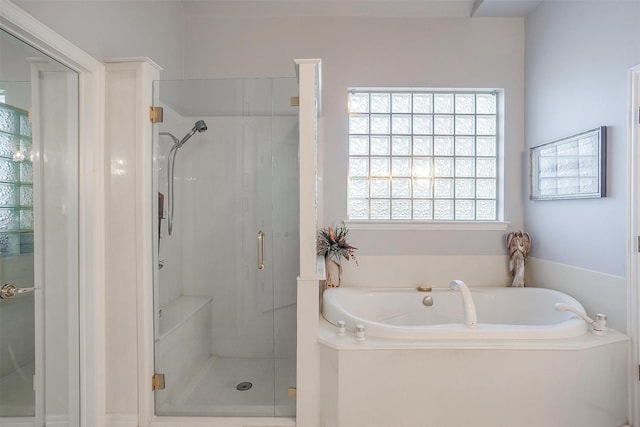 full bathroom with a garden tub and a shower stall