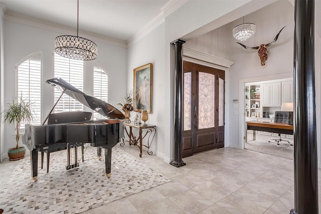 foyer featuring baseboards, light tile patterned floors, a notable chandelier, and crown molding