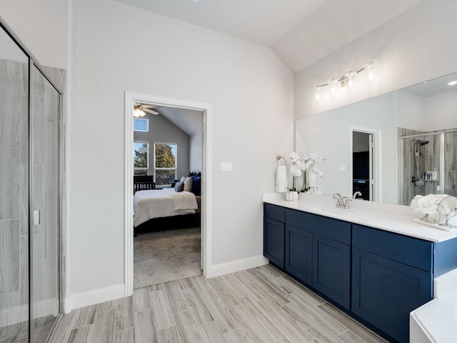 bathroom with a stall shower, wood tiled floor, vaulted ceiling, and connected bathroom