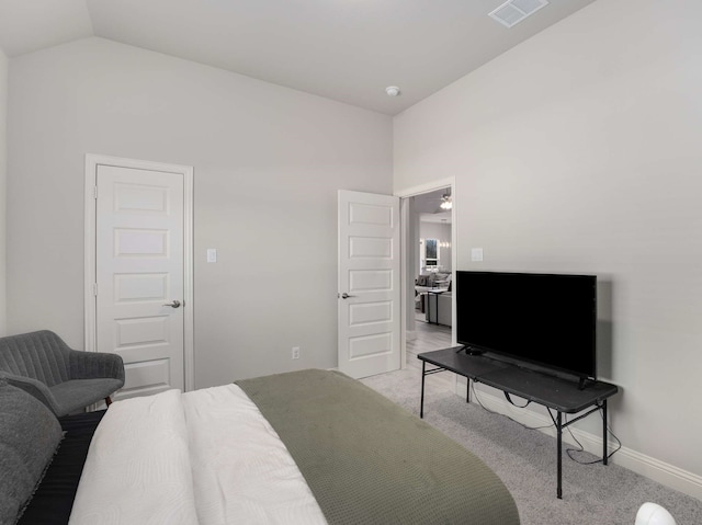 bedroom with light carpet, baseboards, visible vents, and vaulted ceiling