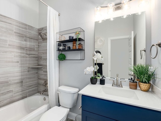 full bath with toilet, shower / tub combo, and vanity