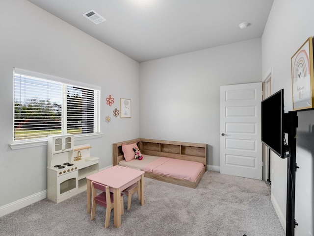 bedroom featuring carpet floors, visible vents, and baseboards