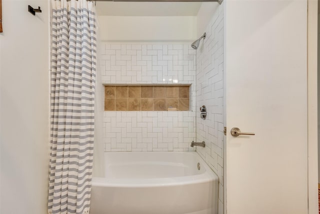 bathroom with shower / bath combo with shower curtain