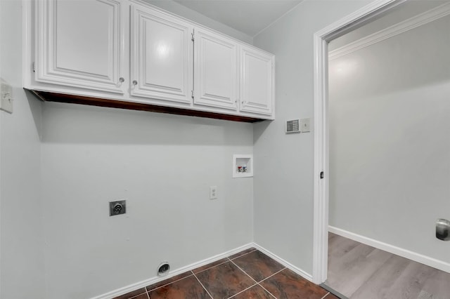 laundry room with cabinet space, baseboards, washer hookup, and electric dryer hookup