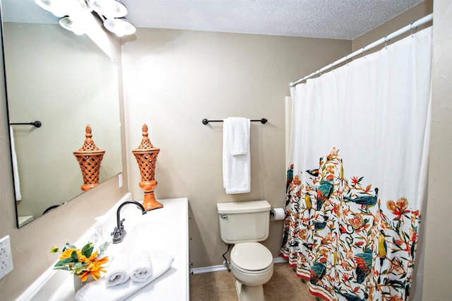 bathroom featuring a textured ceiling, toilet, a shower with shower curtain, vanity, and tile patterned floors