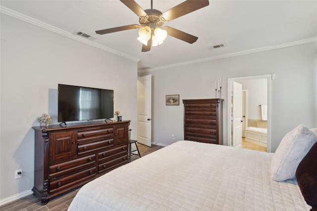 bedroom with visible vents, crown molding, baseboards, and wood finished floors