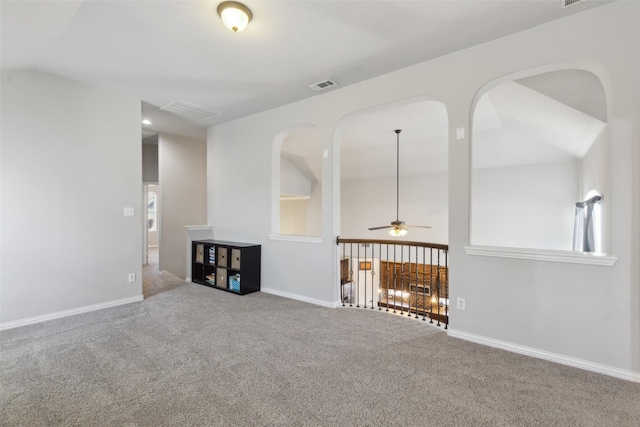 unfurnished living room featuring carpet floors, recessed lighting, visible vents, and baseboards