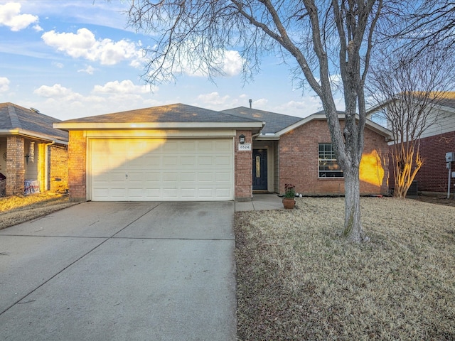 ranch-style house with driveway, a garage, and brick siding