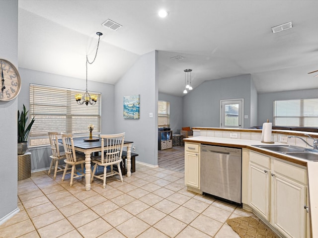 kitchen with lofted ceiling, light tile patterned floors, a sink, visible vents, and stainless steel dishwasher