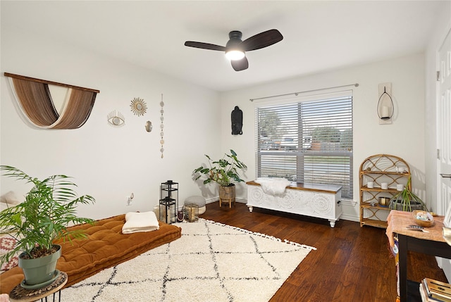 sitting room with wood-type flooring, ceiling fan, and baseboards