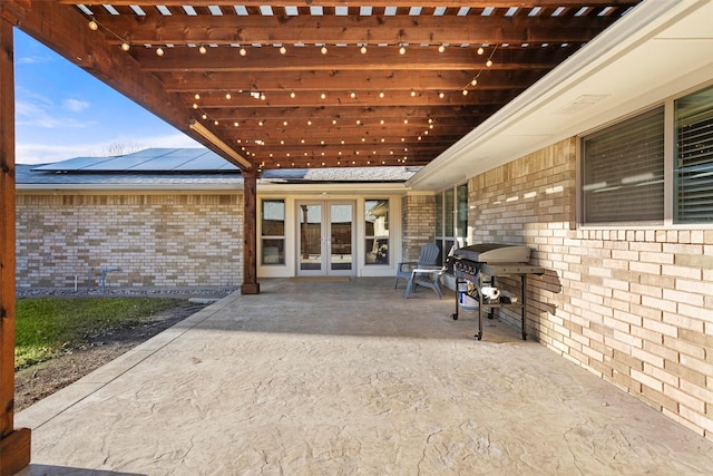 view of patio with french doors, a grill, and a pergola