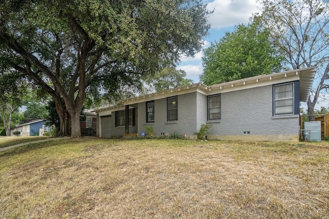 single story home featuring crawl space, brick siding, and a front lawn