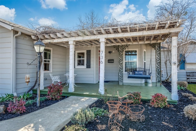 doorway to property featuring covered porch