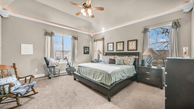 carpeted bedroom featuring ceiling fan, baseboards, and vaulted ceiling