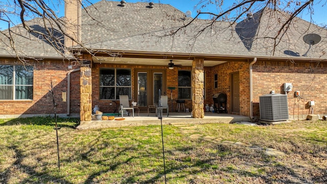 back of property with brick siding, a patio, a shingled roof, central AC unit, and ceiling fan