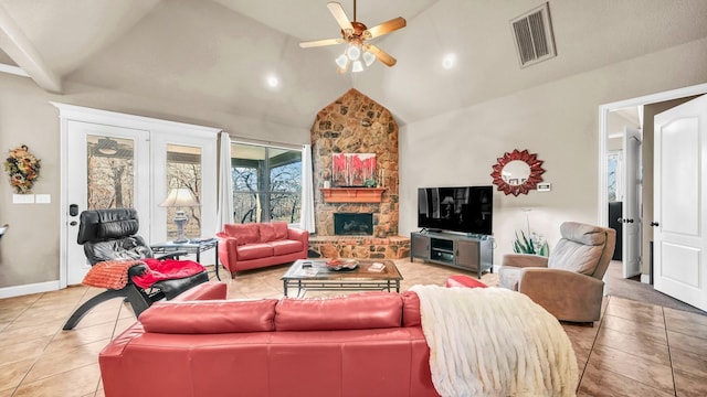 living area with light tile patterned floors, a fireplace, visible vents, baseboards, and a ceiling fan