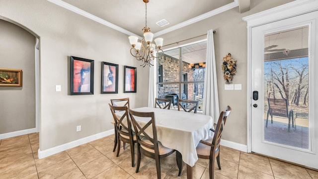 dining space with arched walkways, visible vents, baseboards, and light tile patterned floors