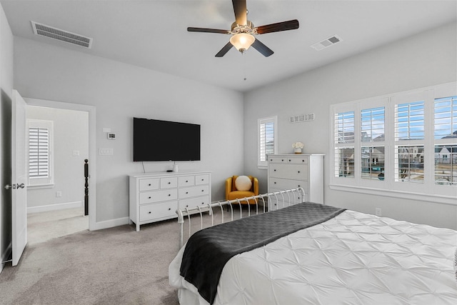 bedroom featuring baseboards, visible vents, ceiling fan, and carpet flooring