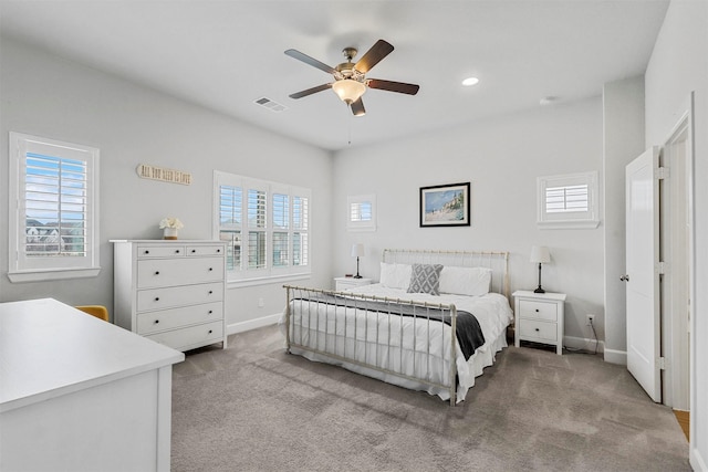 bedroom with recessed lighting, light colored carpet, visible vents, a ceiling fan, and baseboards