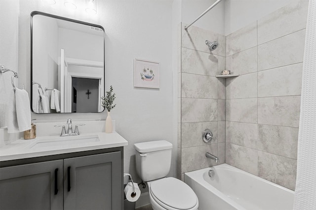 full bathroom featuring toilet, tub / shower combination, and vanity